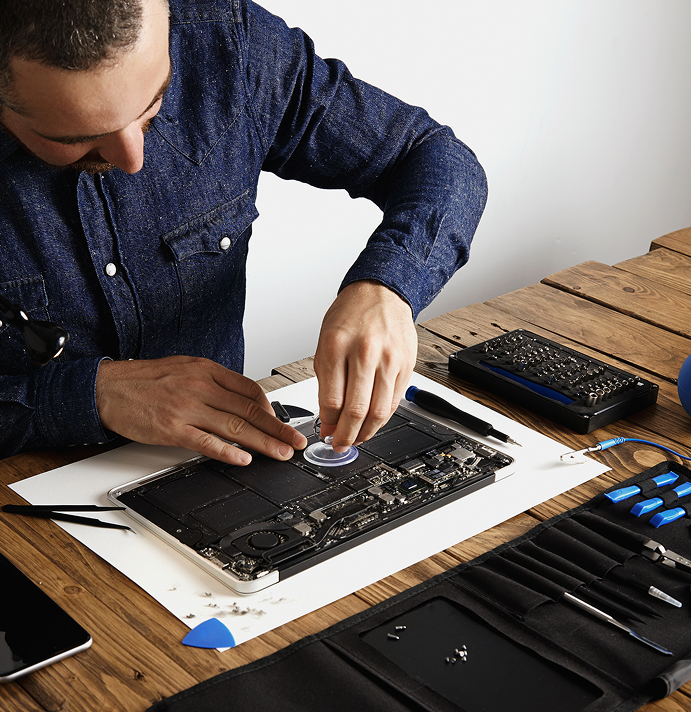 Technician repairing laptop